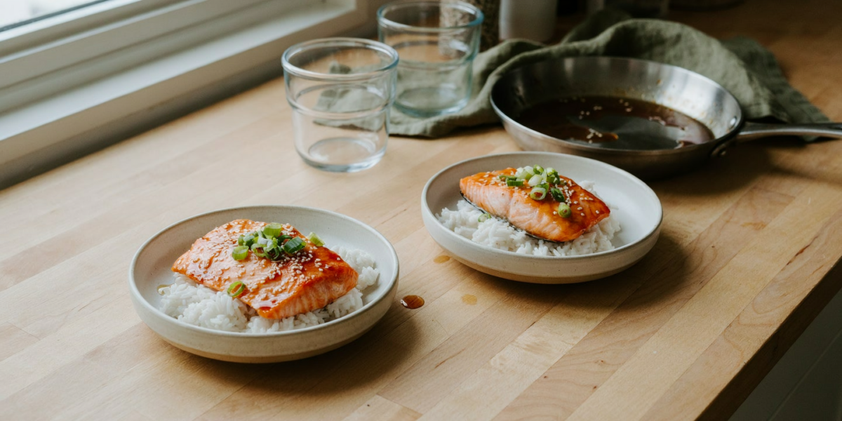 Glazed salmon fillets with rice and sliced green onions